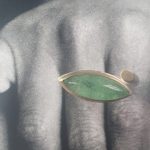 Ring mit grünem Stein